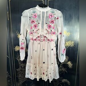 white dress with flower patches